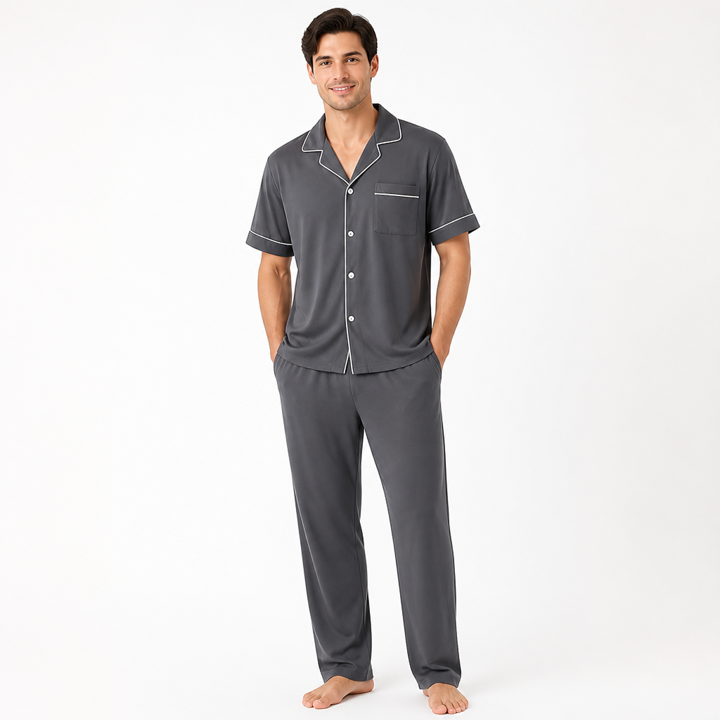 Man wearing a charcoal grey EiderWeave bamboo pajama set with short-sleeve top and trousers
