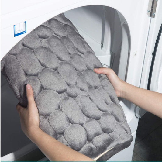Embossed memory foam bath mat with a cushioned surface